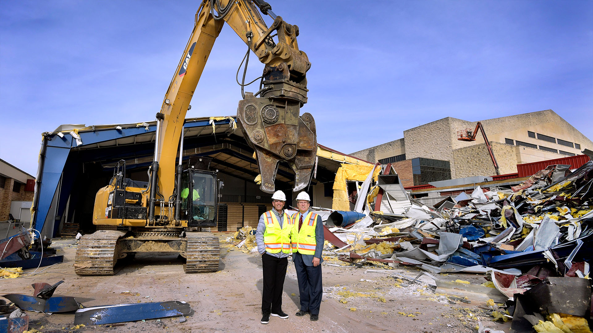 AD Jeff Long and head coach Ray Bechard pose during demolition